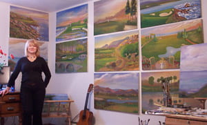 Lee in her studio with other course paintings.