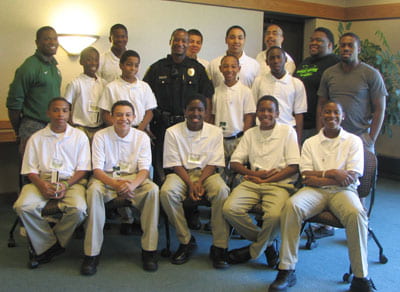 Phoenix Scholars and mentors, above, with Officer Solomon Ayres