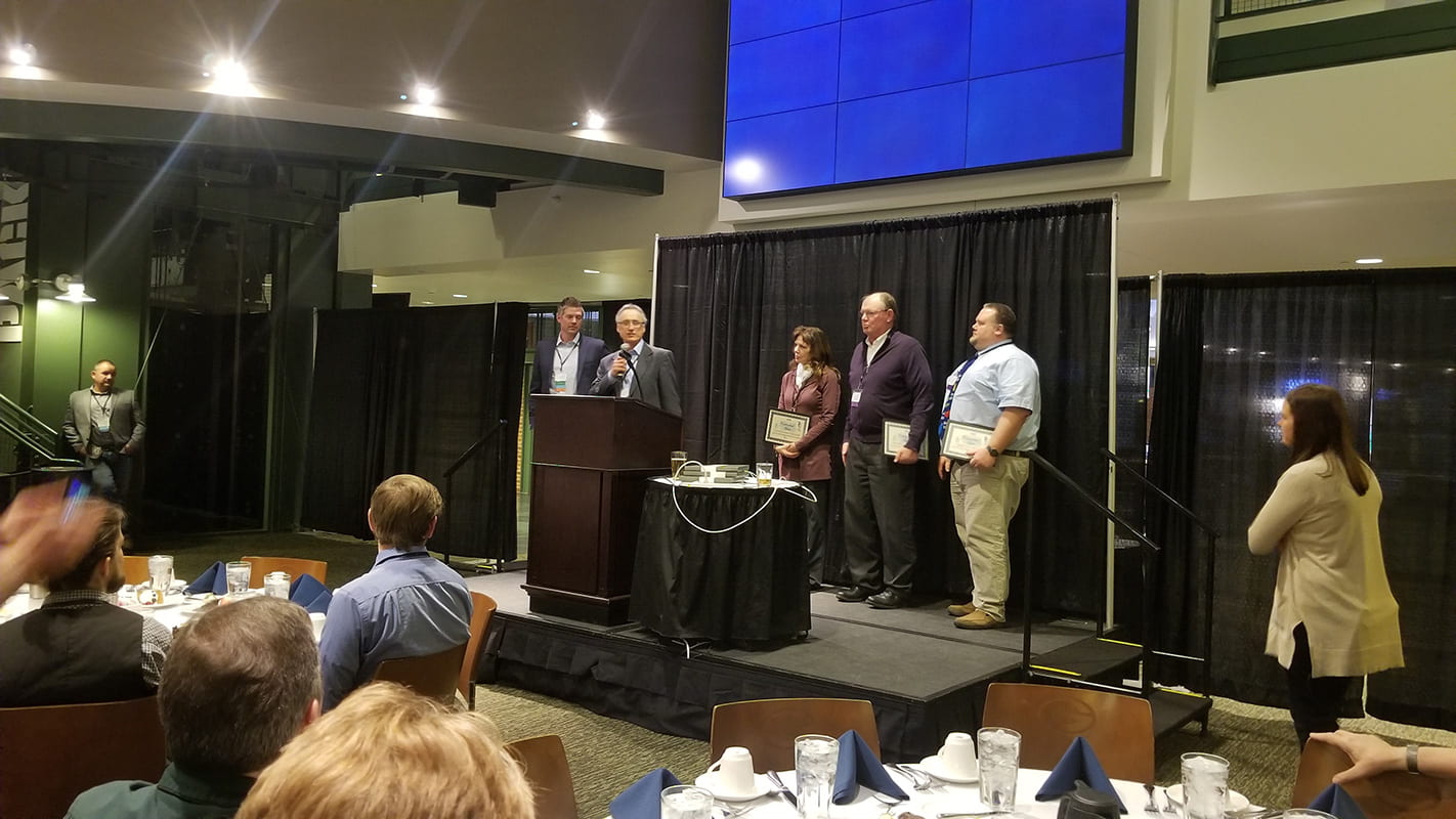 Accepting the 2018 Watershed Hero Impact award for UW-Green Bay was Kevin Fermanich, along with high school partners Lynn Terrien, Green Bay Southwest; Charlie Frisk, Luxemburg-Casco (retired) and Ryan Marx, Appleton East.