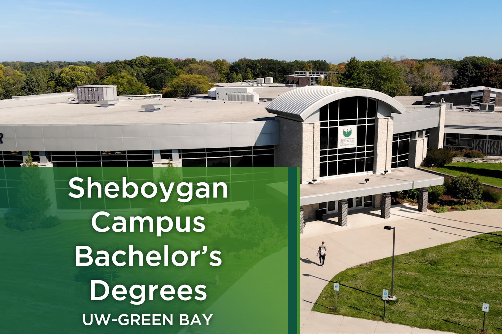 Ariel photo of a student wearing a backpack walking towards the front entrance of the UW-Green Bay Sheboygan Campus.