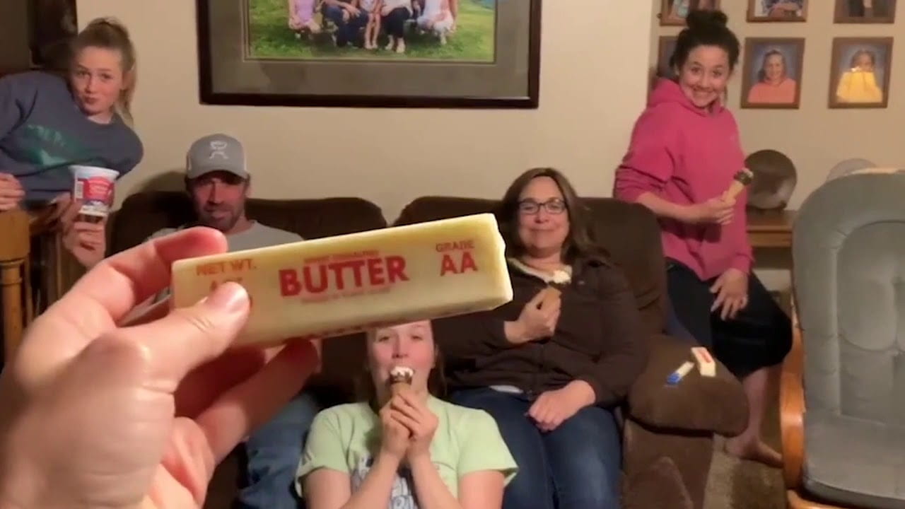 Anna Dier Lip Sync Battle video stillframe, holding up a stick of butter