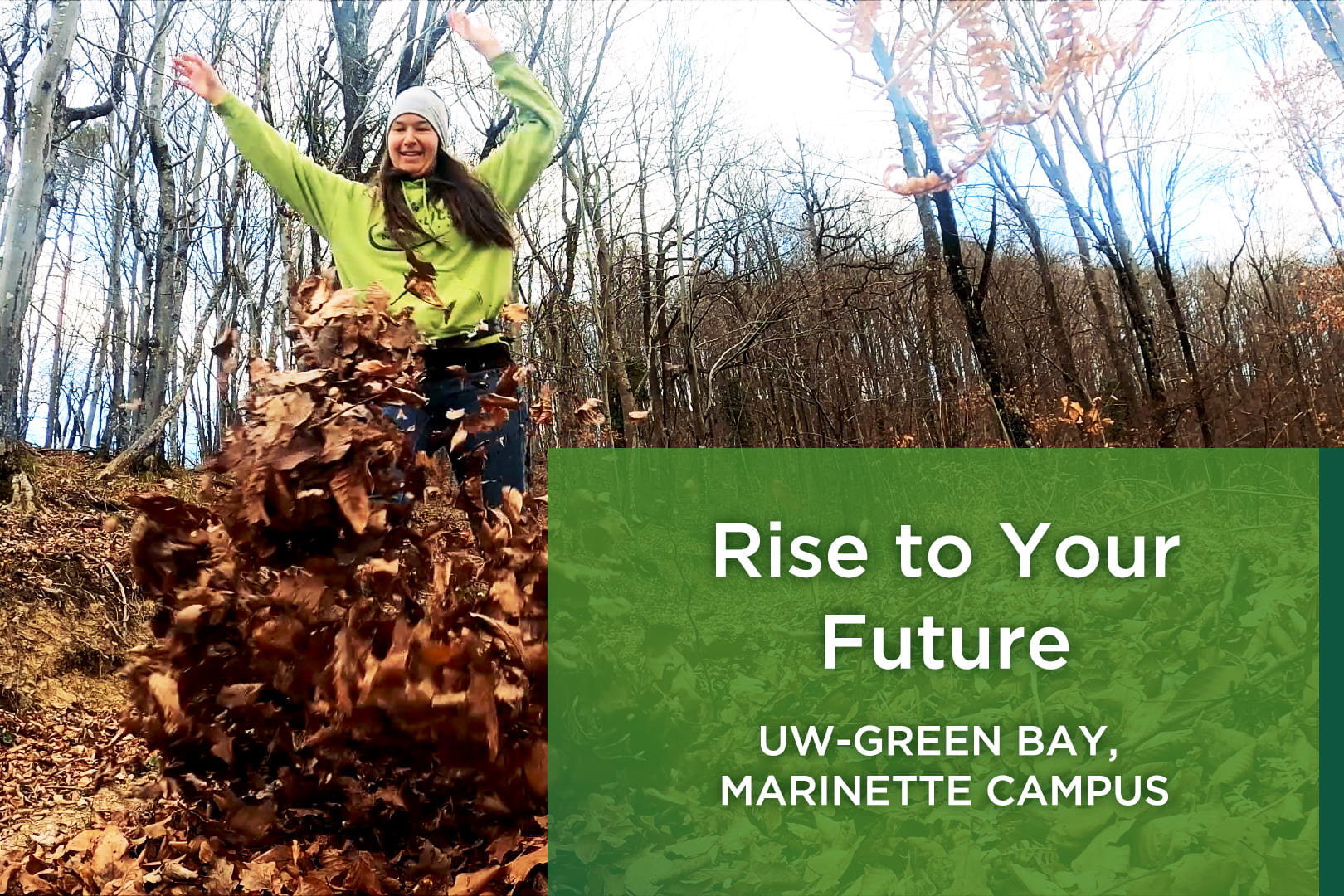 Photo of college student running through fallen leaves with her arms raised up over her head. She is laughing and smiling.