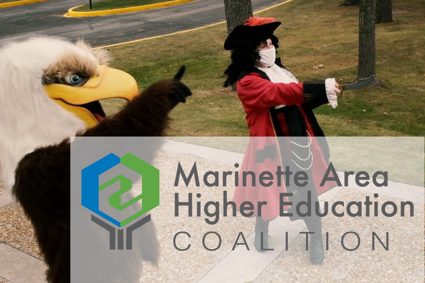 Photo of the NWTC, Marinette mascot the "Eagle" posing with the UW-Green Bay, Marinette mascot, the "Buccaneer" at the UW-Green Bay, Marinette campus.