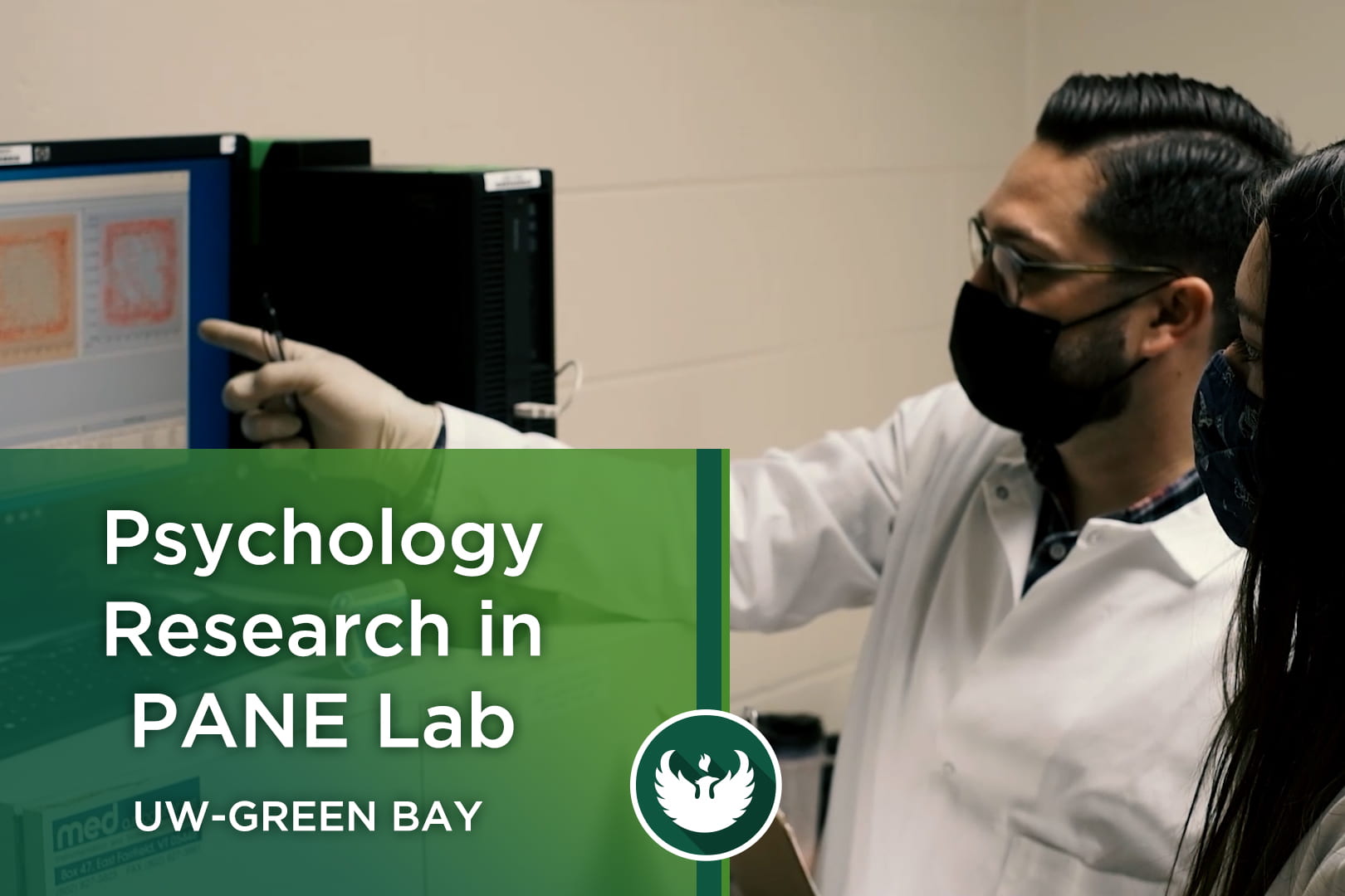 Assistant Professor Todd Hillhouse works with research student Peyton Koppenhaver on how to run a conditioned place preference test as they research a new psychopharmacological approach for pain relief inside the PANE Lab in the Lab Sciences building at UW-Green Bay.