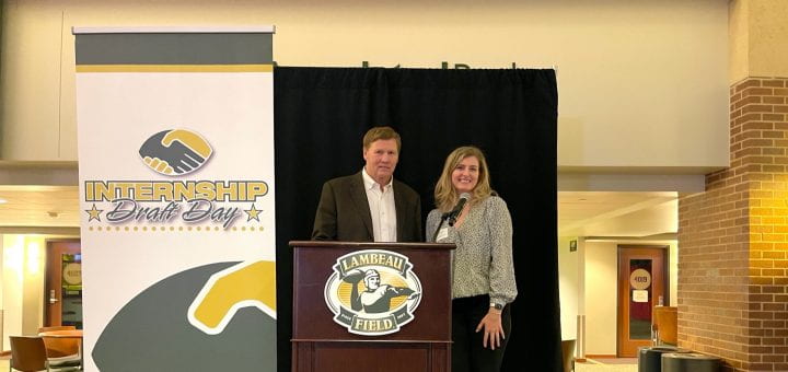 Packers President and CEO Mark Murphy presents Draft Day award to Kendra Lepper