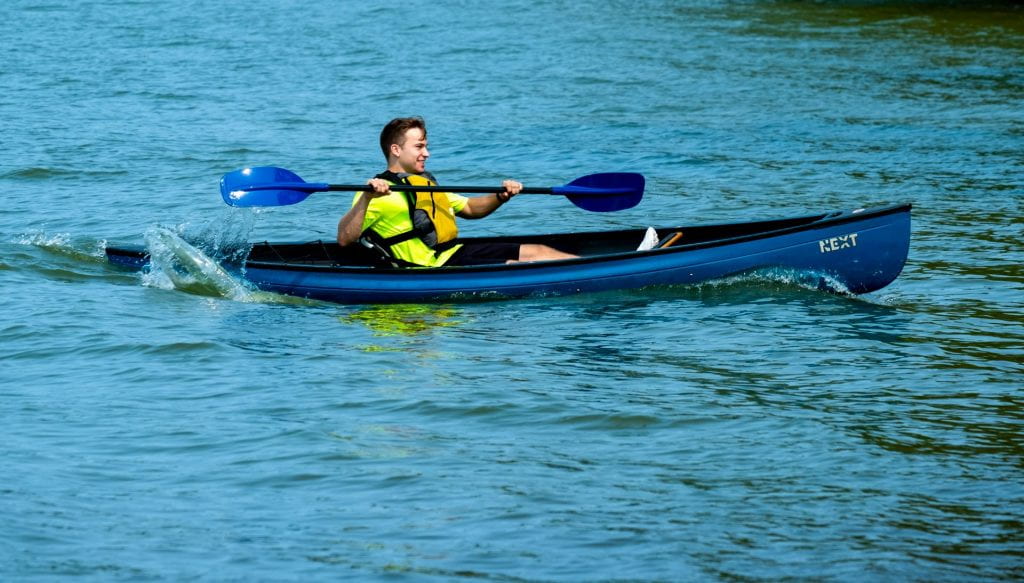 A male students has fun canoeing on the Bay of Green Bay during GB Week’s Boats on the Bay event on Saturday, September 11, 2021, near the UW-Green Bay, Green Bay campus.