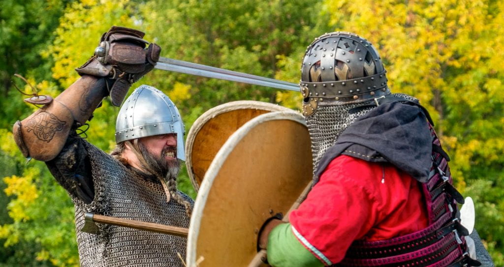 At the Green Bay Viking Festival two Viking clash weapons during a battle reenactment at UW-Green Bay Viking House grounds on Saturday, October 2, 2021. 