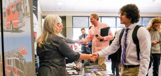 A student shakes an employers hand after discussing an internship at the company during the Job and internship fair at UW-Green Bay.