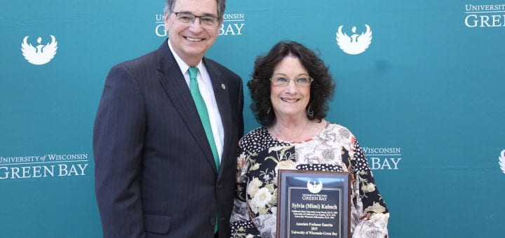 Mimi Kubsch receiving her Associate Prof. Emeritus plaque in May 2019