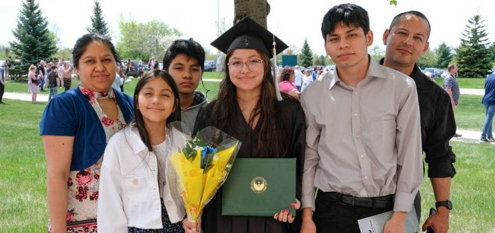Graduate and family celebrate post commencement
