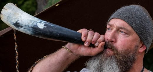A reenactor blows on a Viking horn during a demonstration at the Midwest Viking Festival at the UW-Green Bay Viking House grounds.